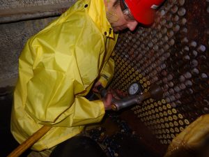 Technician using Pumping System for Tube Cleaning